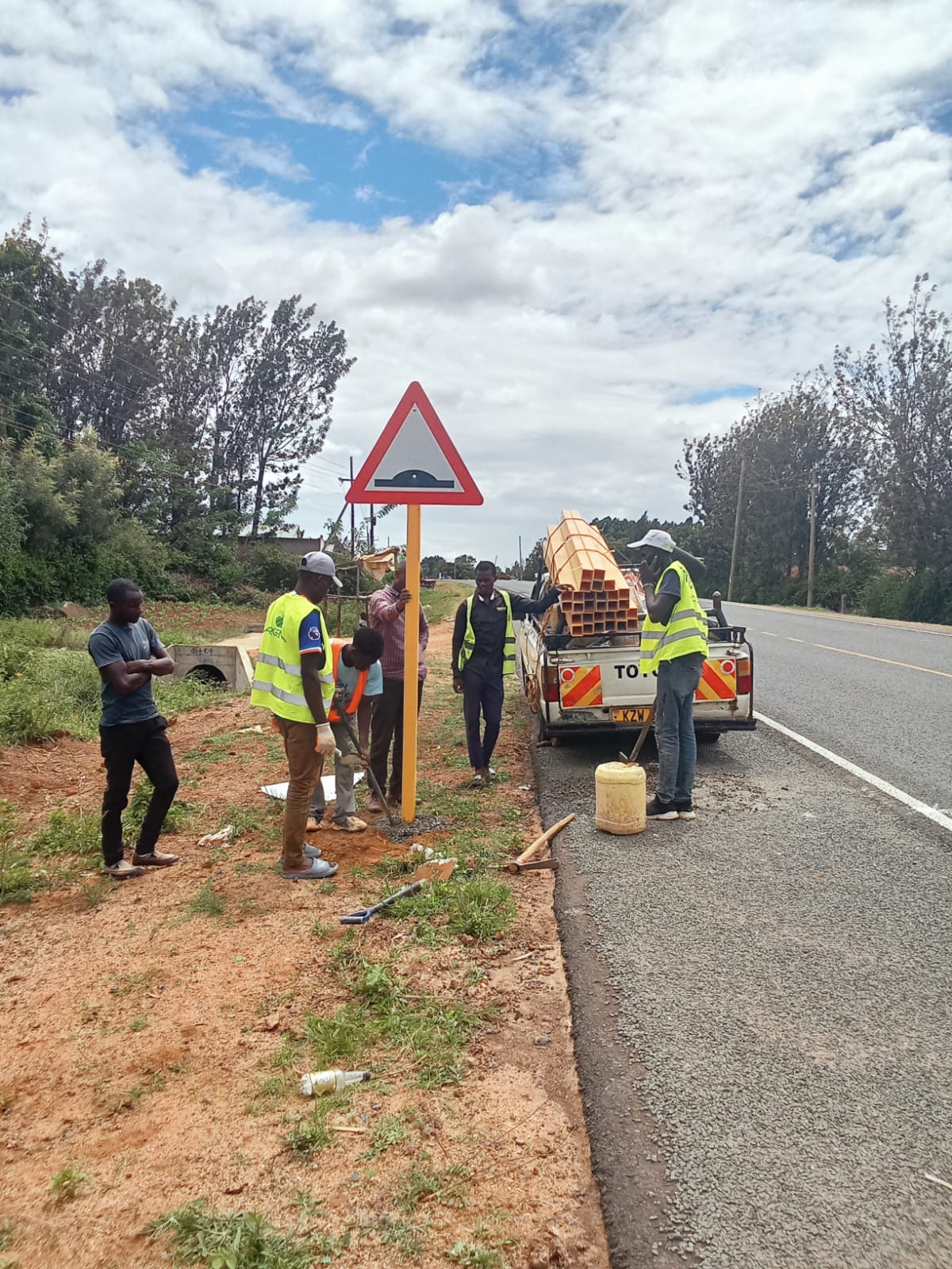 Speed hump warning sign installation with mobile logistics truck